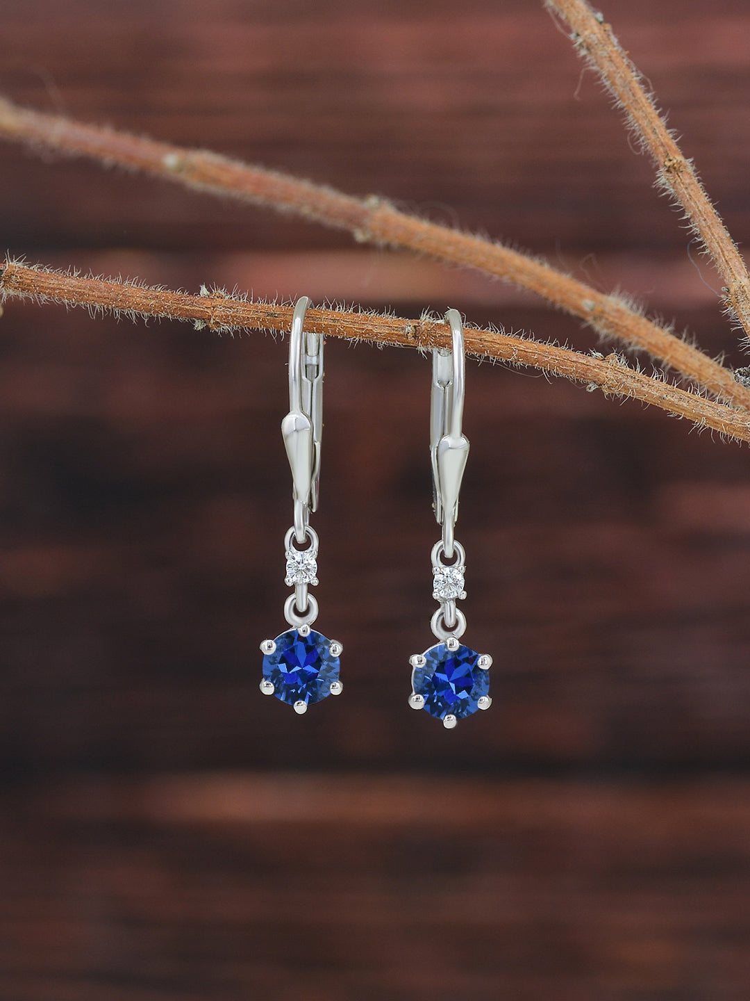 Ornate Jewels Blue Sapphire Dangle 925 Silver Earrings For Women